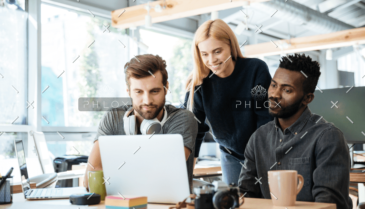Happy Colleagues Sitting In Office Coworking PHYA6TG